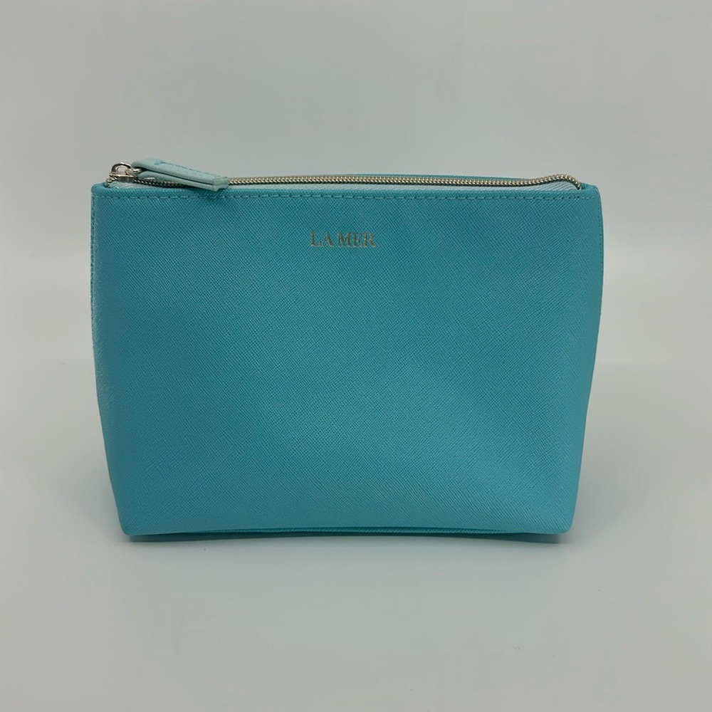 New/unused. La Mer Blue makeup/ toiletry bag.